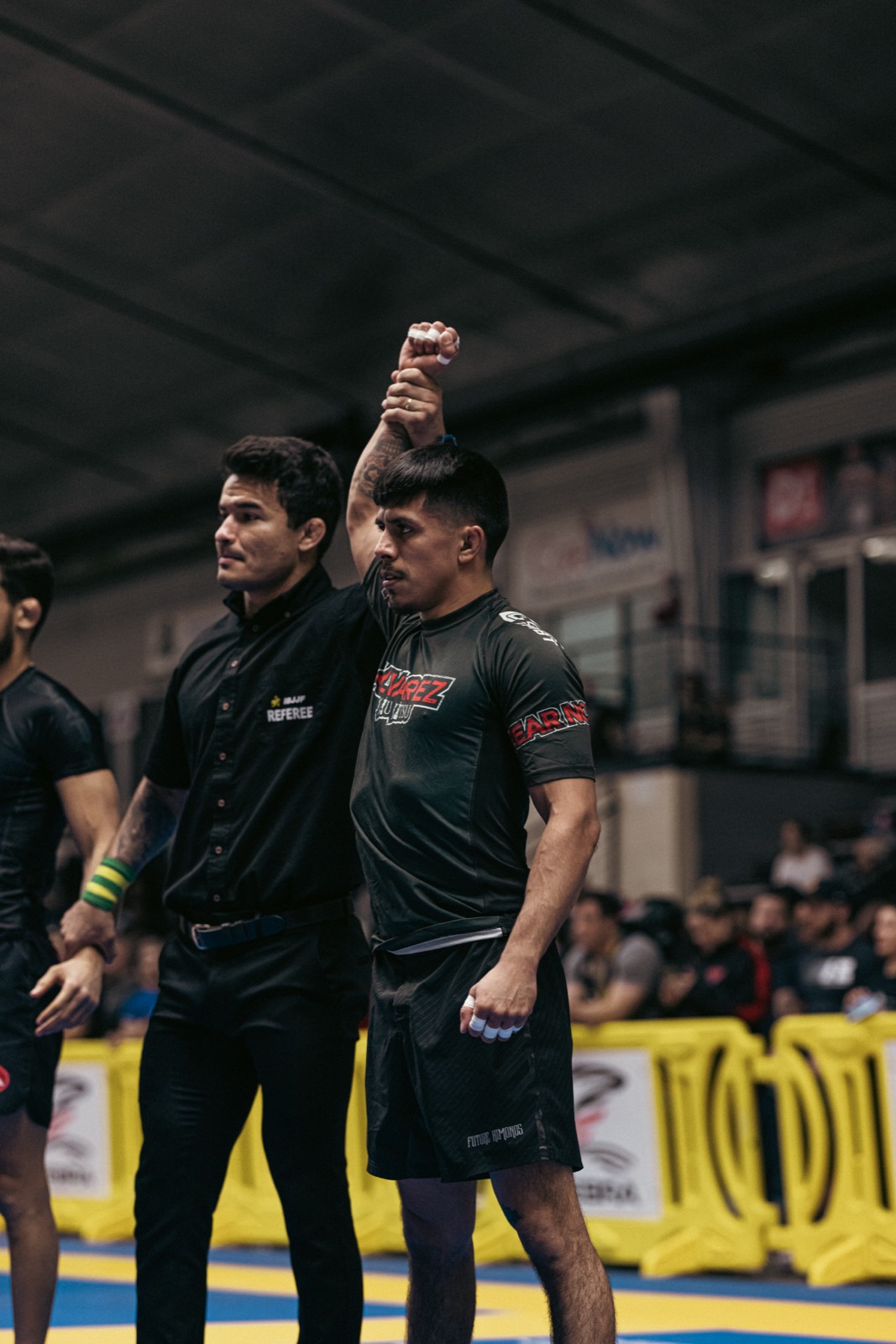 Vasquez Jiu-Jitsu competitor getting his hand raised in victory at a tournament