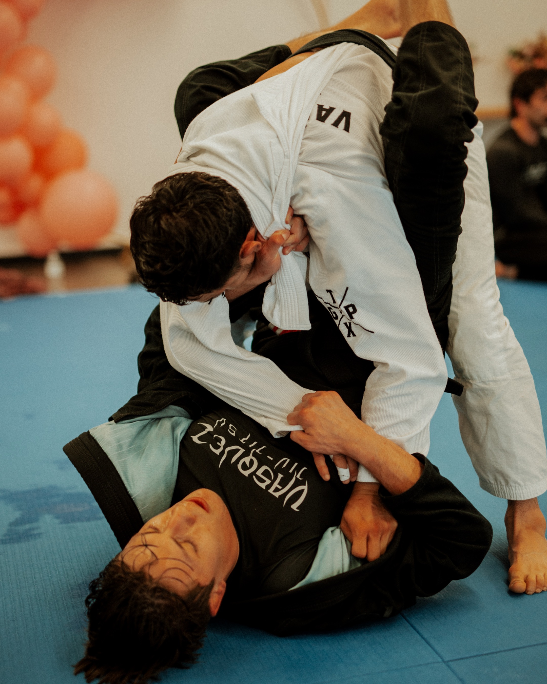 Gi sparring during a class at Vasquez Jiu-Jitsu