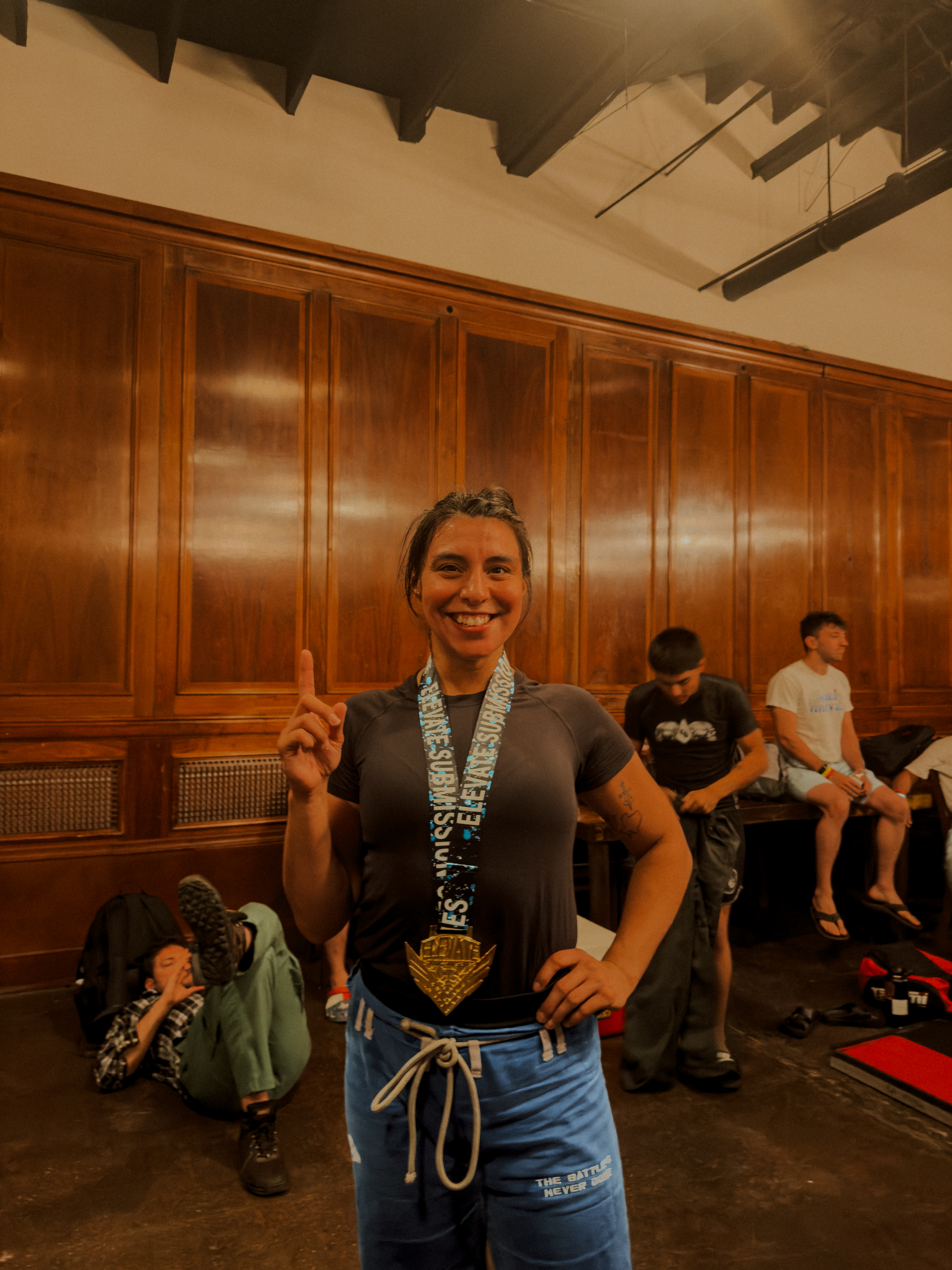 Vasquez Jiu-Jitsu athlete with her first-place medal after a tournament
